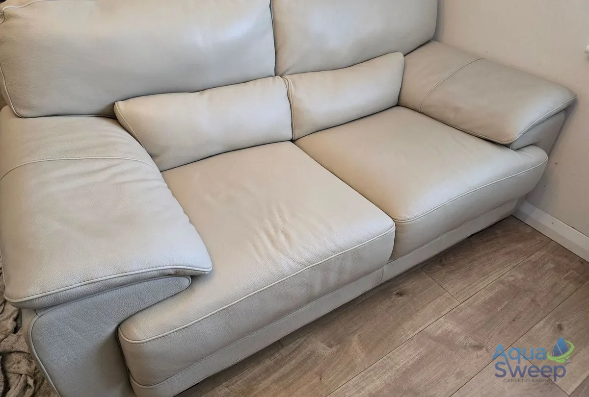 After: cream leather two seater sofa