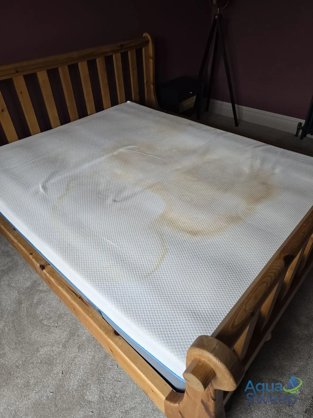 Before: white mattress with large yellow stains