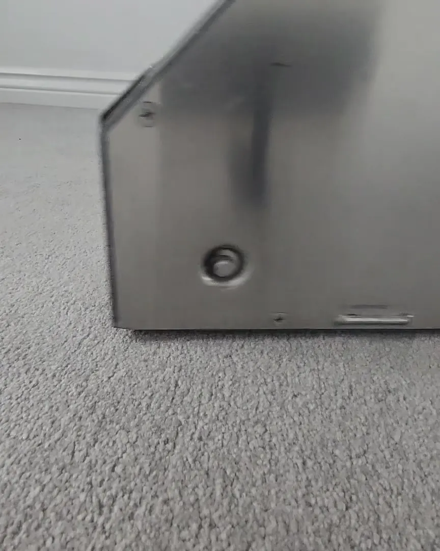 Agitation machine brushing the cleaning solution into a light grey carpet